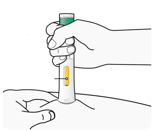 A hand holding vertically a white medical device with a yellow indicator while the tip is pressed against the skin of a