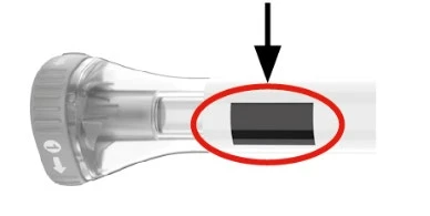 Transparent medical device with a red circle and a black arrow highlighting a dark rectangular window on the body of the device