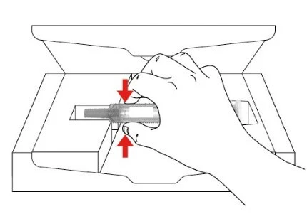 A hand pressing down a medical device