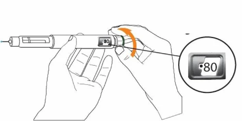 Due mani tengono una penna iniettiva bianca con una freccia arancione che indica la rotazione della parte superiore per impostare il dosaggio a 80