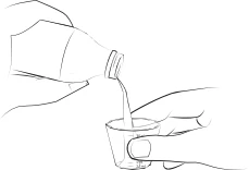 Two hands carefully pouring the contents of a bottle into a small graduated cup for medication measurement