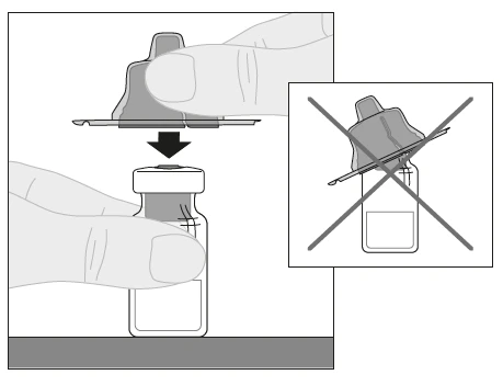 A hand presses a protective cap onto a glass vial while a box with a cross indicates not to do it at an angle