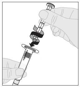 A hand holds a syringe while the