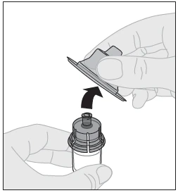 A hand lifts a protective cap from a medicine vial following the direction indicated by a curved black arrow