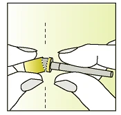 Two hands separating a yellow cap from a long, thin cylindrical medical device along a vertical dashed line