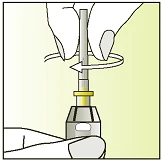 A hand holding an injection pen while the