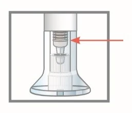 Technical diagram of a transparent medical device with a red arrow pointing to the upper part of the internal mechanism