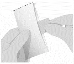 Two hands holding and folding a white instruction leaflet to open it or separate its pages