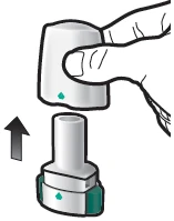 A hand gripping the top of a medical device to insert it downward