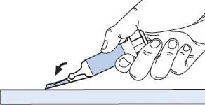 Two hands holding a tilted syringe being rotated to the left over a flat surface with a black curved arrow indicating the movement