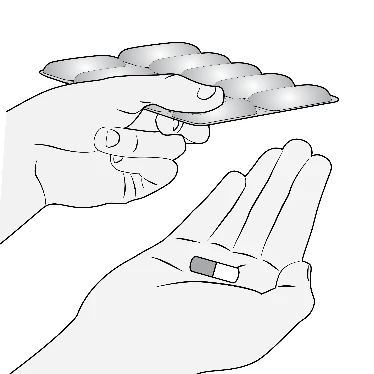 Two hands holding a blister pack of pills and a single two-colored capsule resting on the palm of the lower hand