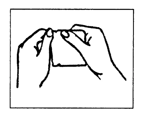 Two hands holding and carefully opening a small container or medicine package to remove its contents