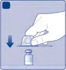 A hand pressing a medical device downward to puncture the top of a small glass vial, with a blue arrow pointing downward