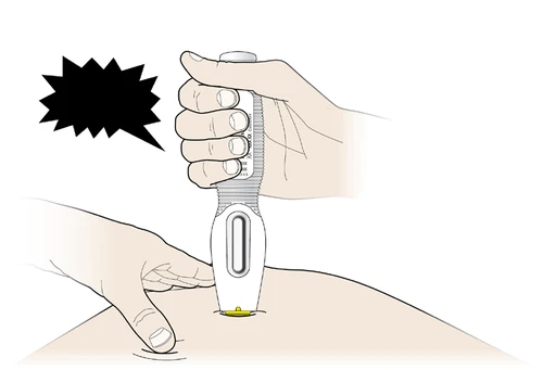 A hand holding an automatic medical device for the