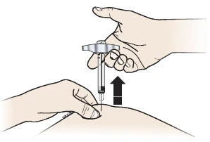 A hand holding a medical device with needle while the