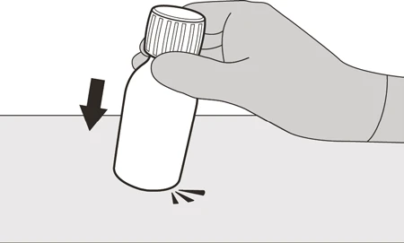 A gloved hand holds a vial and pushes it downward onto a flat surface following the direction of a black arrow
