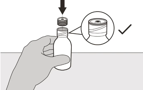 A hand holds a small vial while a cap is pressed downward with a black arrow, and an enlargement shows the detail of the hole