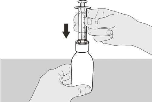 Two hands operate a syringe to aspirate liquid from a vial, with a black arrow indicating downward movement
