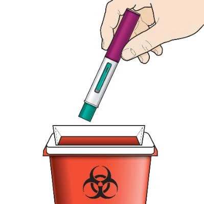 A hand holding a white and purple injection pen above a red biological waste container with biohazard symbol