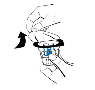 A hand lifts the protective cap off a blue medical device while the