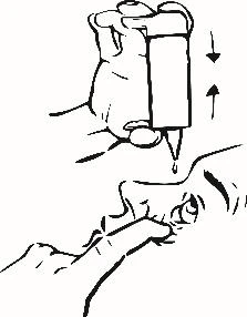 A hand holding a medical device above a person's nose while a