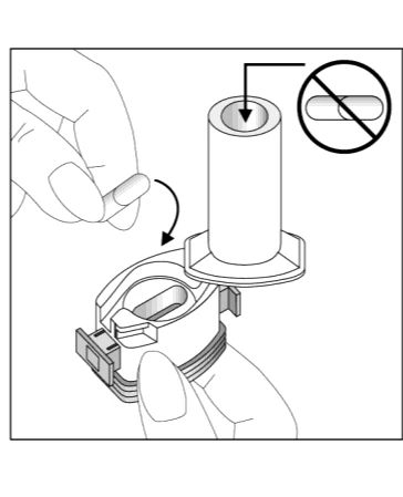 Technical drawing showing a hand inserting a capsule into a circular medical device, with a prohibition symbol on a separate capsule