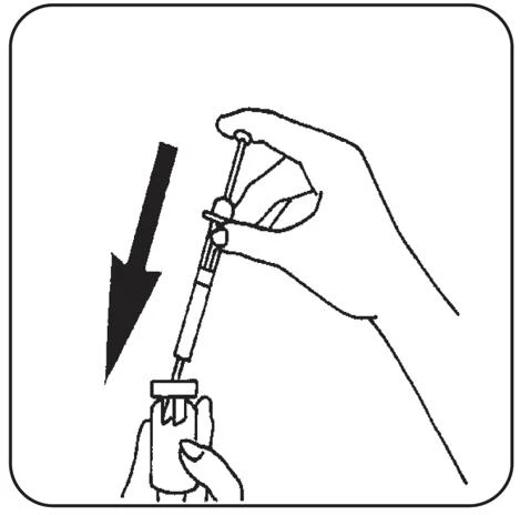 A hand holds a syringe with needle and the tip is inserted into a vial held by the