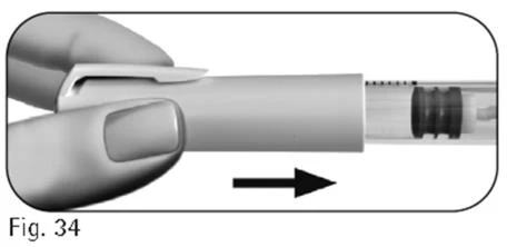 Two fingers hold a cylindrical medical device with a black arrow indicating a sliding movement to the right