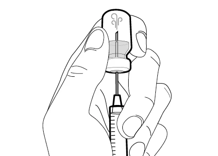 A hand holds a glass vial while with the