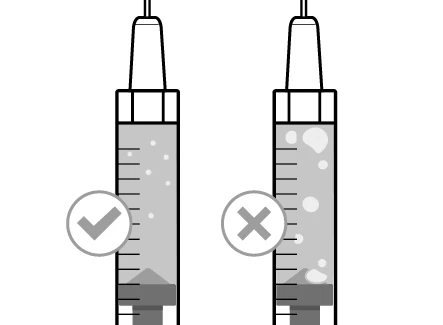 Two vertical syringes with gray liquid; the one on the left has a green checkmark, the one on the right has a gray cross over air bubbles
