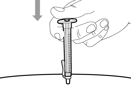A hand presses the plunger of a syringe downward to inject the contents through the