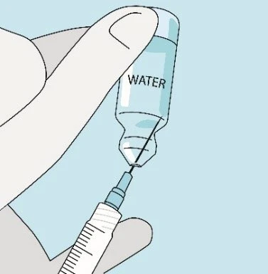 A hand holding a transparent water-filled ampoule with the