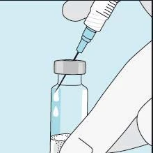 A hand holds a syringe with the needle inserted into the rubber stopper of a glass vial containing a clear liquid on a blue background