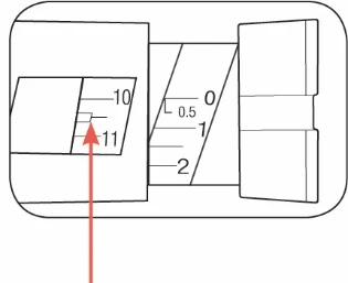 Disegno tecnico di un dispositivo medico con scala graduata che mostra i numeri 0, 0.5, 1, 2 e 10, 11 con una freccia rossa che punta al numero 11