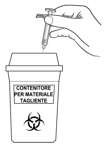 A hand holds a syringe with the needle