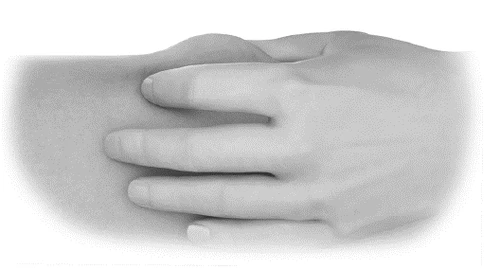 A hand gently resting over a