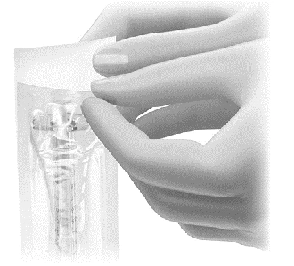 Two hands carefully opening a transparent plastic pouch containing a liquid medication vial with internal graduated scale