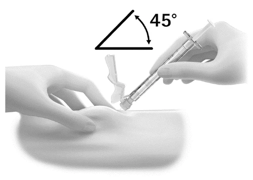 A hand holding a syringe angled at 45 degrees while the