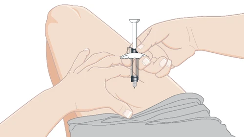 Two hands stretching the skin of the thigh while a