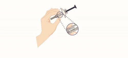 A hand holding a syringe with a circular magnification showing details of the text printed on the transparent part of the device barrel