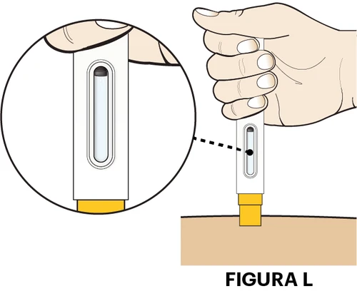 A hand holding a white medical device for
