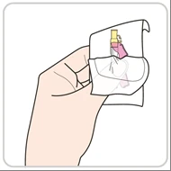 A hand holding and opening a white plastic pouch to remove a medical vial with a yellow cap and pink liquid inside