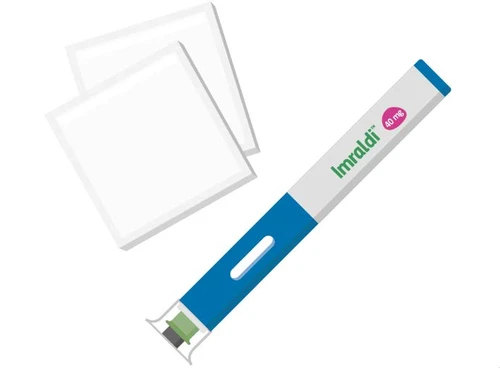 A cylindrical white and blue applicator labeled Imraldi 40 mg next to two transparent square white adhesive patches on a neutral background