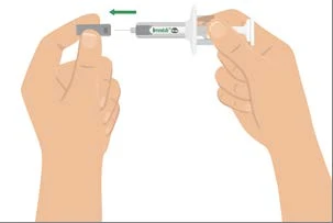 Two hands holding a pre-filled syringe to attach a protective cap to the tip