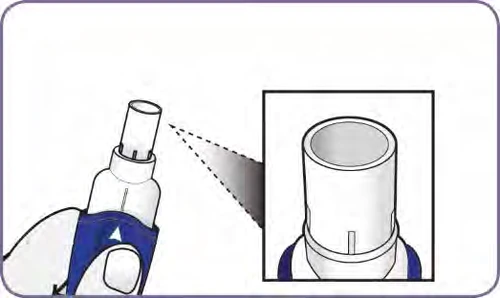 Magnified detail of the top part of a white medical device with a