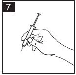 One hand holding a syringe with the