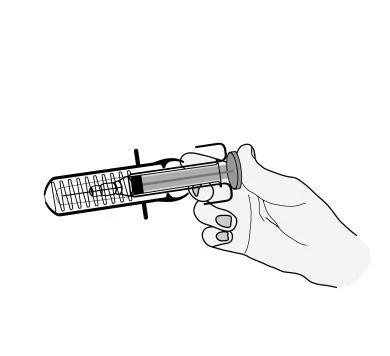 A hand holds a horizontal syringe with needle and plunger for the