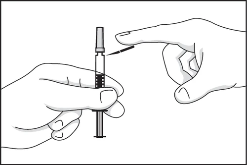 One hand holds a syringe vertically while the