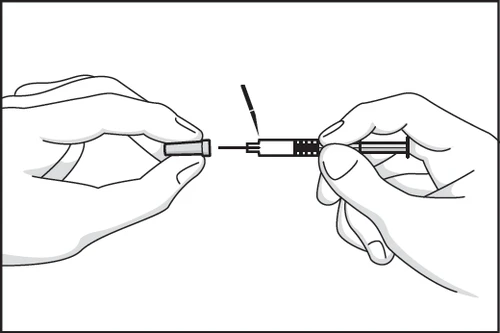 Two hands separating a protective cap from the body of a syringe with a needle to prepare the