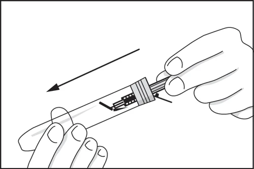 One hand holds a syringe while the
